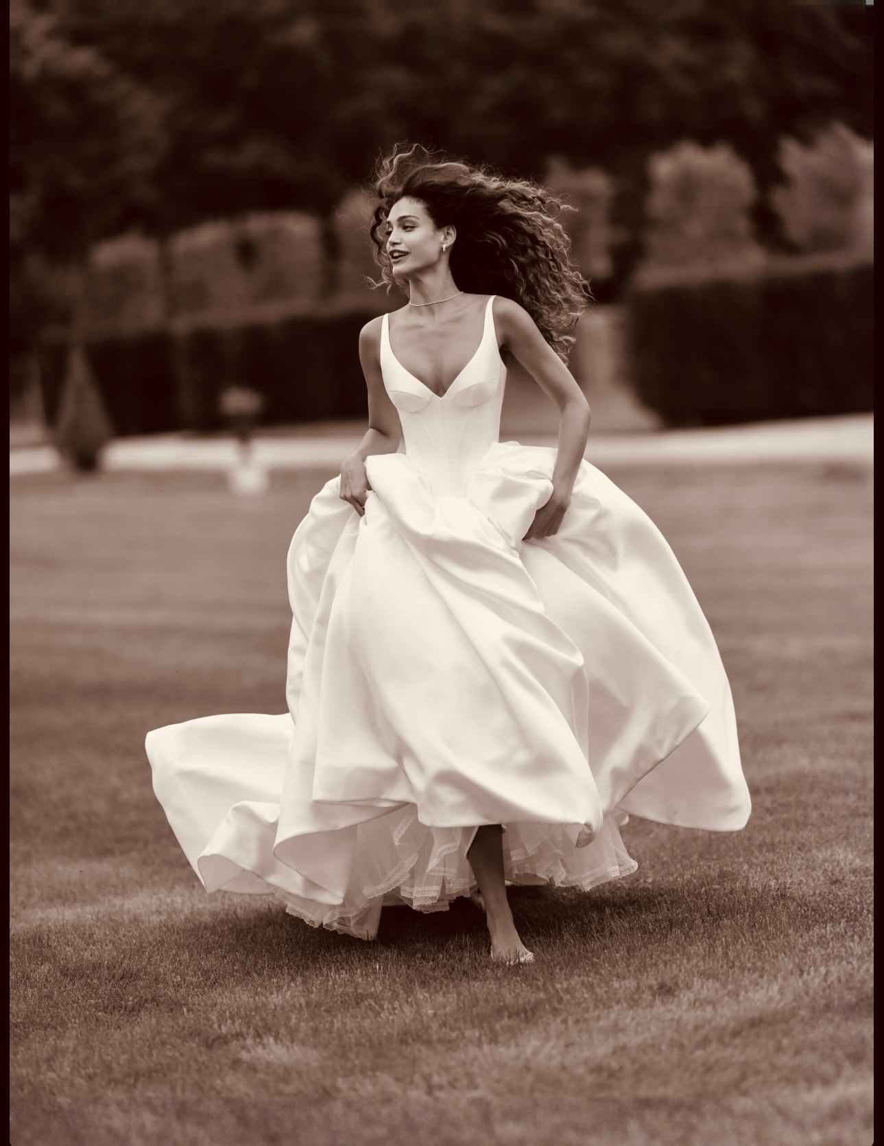 Bride running in her wedding gown
